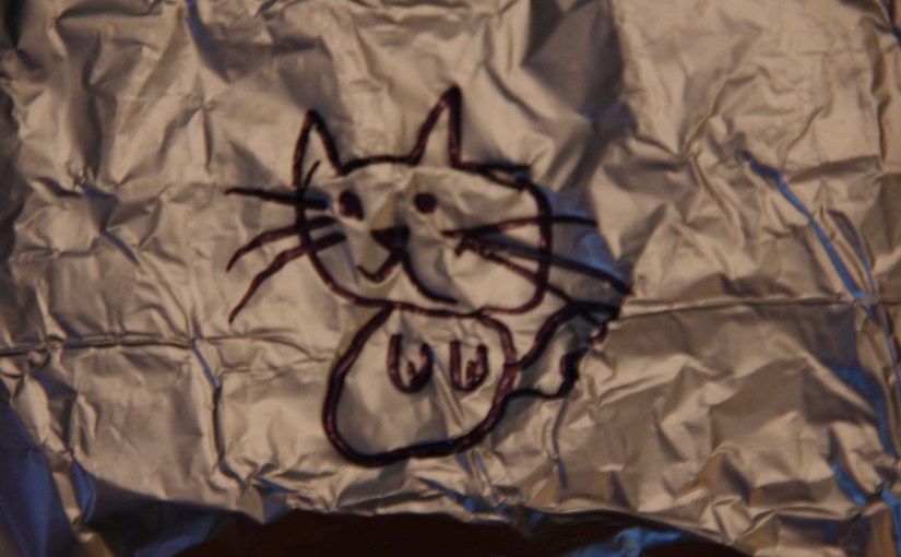 Aluminum foil packet dinner decorated with a merfish