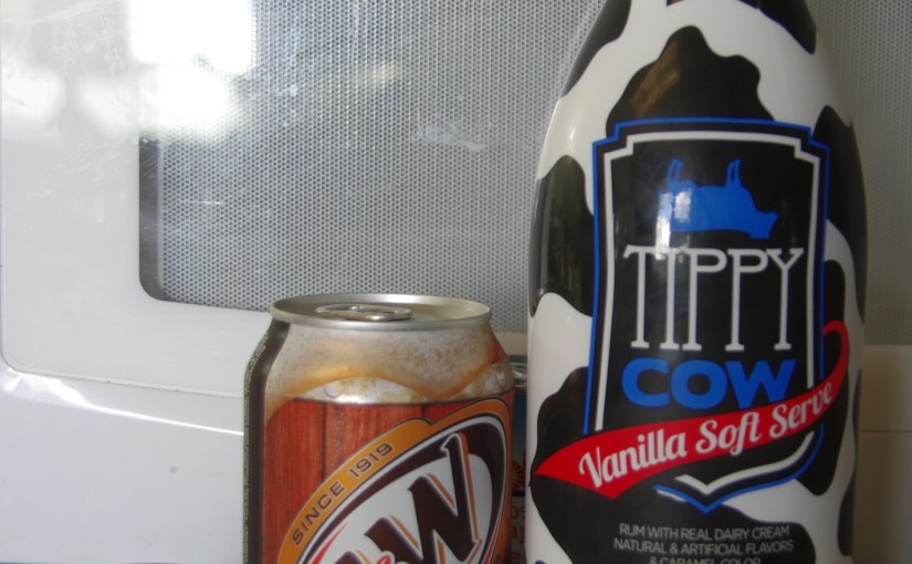 Shot glass, can of root beer, and rum cream liqueur